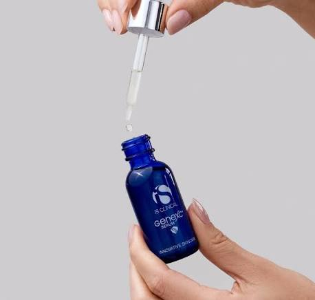 eyedropper over blue bottle of iS Clinical cosmetic